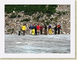 Alaska 214 * Our group of explorers milling about the glacier just after Robert's departure to climb the mountain behind them. * Our group of explorers milling about the glacier just after Robert's departure to climb the mountain behind them. * 2816 x 2112 * (4.1MB)